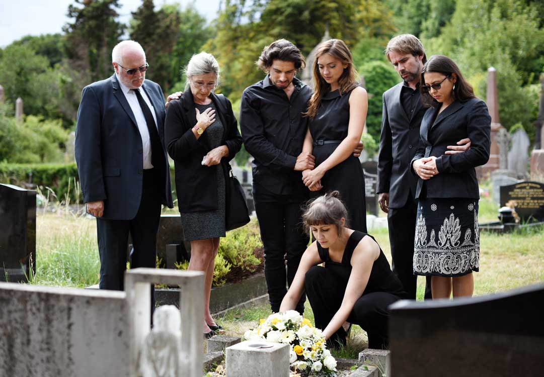 Family that depicts what to wear to a funeral in the summer