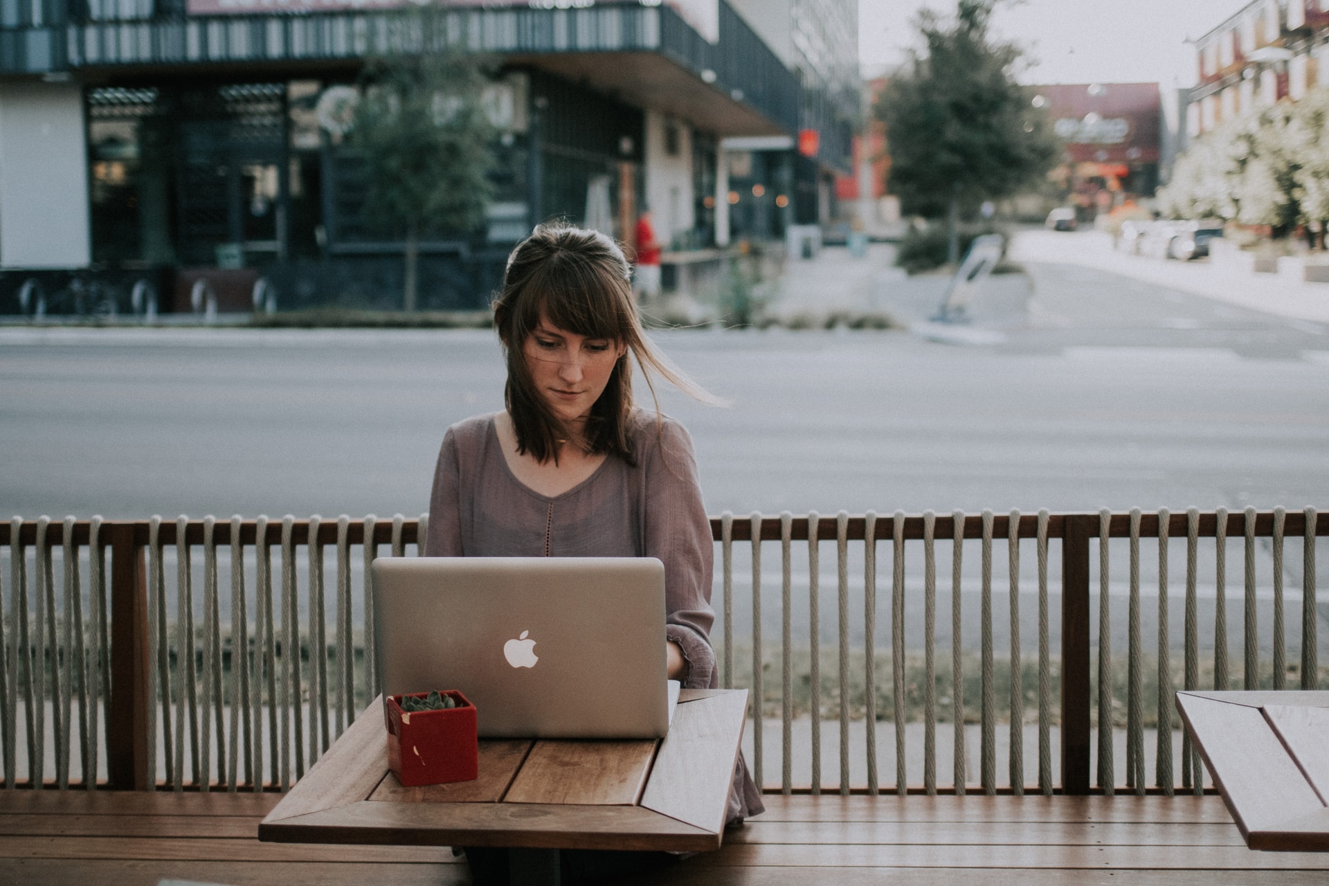 A lady searching how to find out how someone died online on laptop.