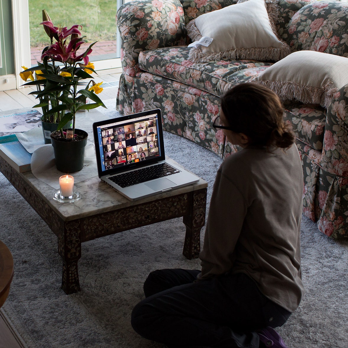 A lady attending Funeral using zoom call.